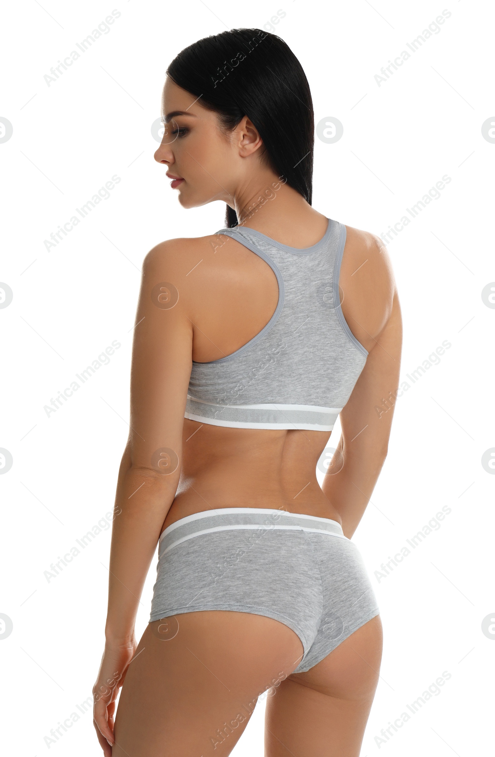 Photo of Beautiful young woman in grey sportive underwear isolated on white