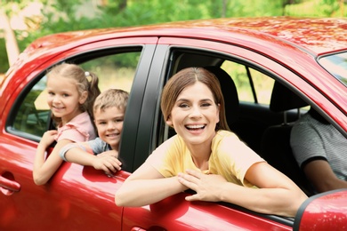 Happy family with children taking road trip together