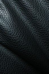 Black natural leather as background, top view