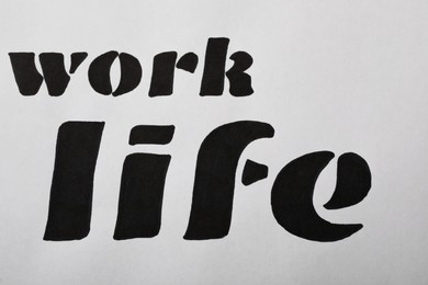 Photo of Work, Life written on white background, top view. Balance concept