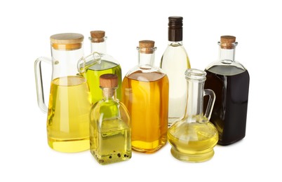 Photo of Vegetable fats. Glassware of different cooking oils isolated on white