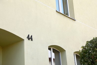 Photo of House number 44 on beautiful building outdoors