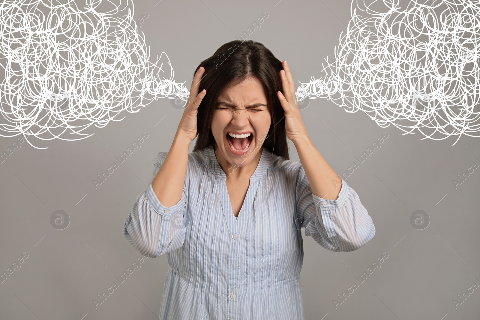 Image of Stressed and upset young woman on grey background