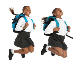 African American girl in school uniform jumping on white background