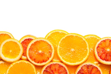 Slices of fresh citrus fruits on white background, top view