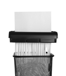 Photo of Destroying paper with shredder on white background