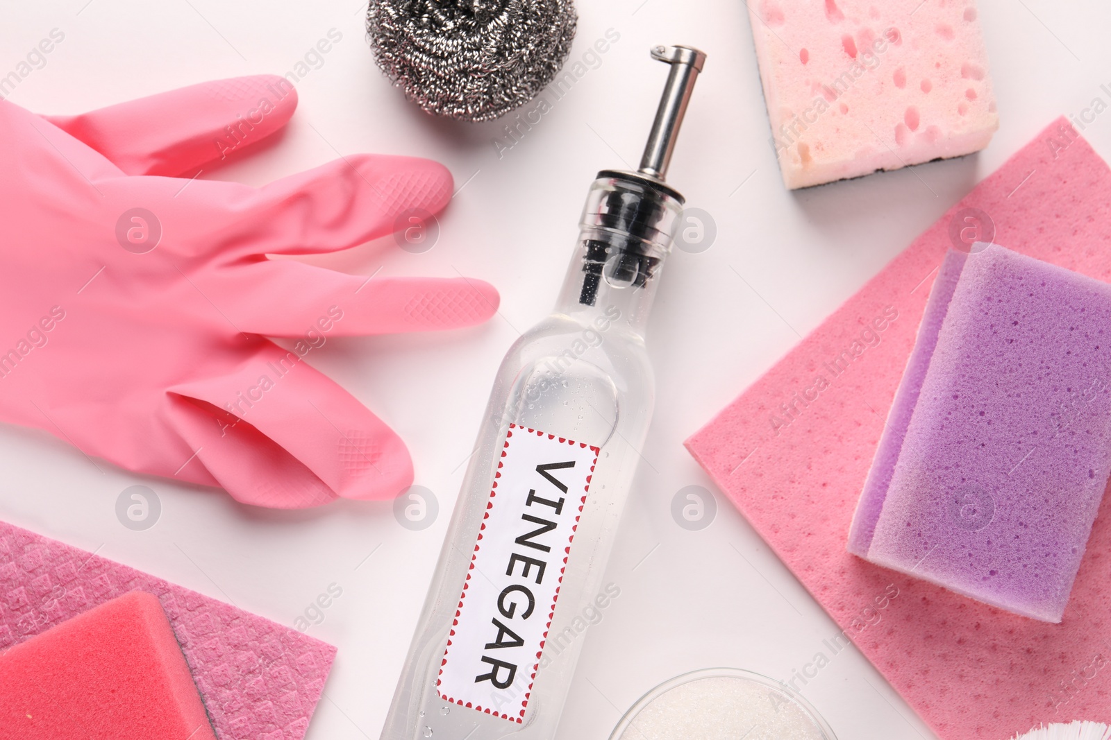 Photo of Eco friendly natural cleaners. Flat lay composition with bottle of vinegar on white background