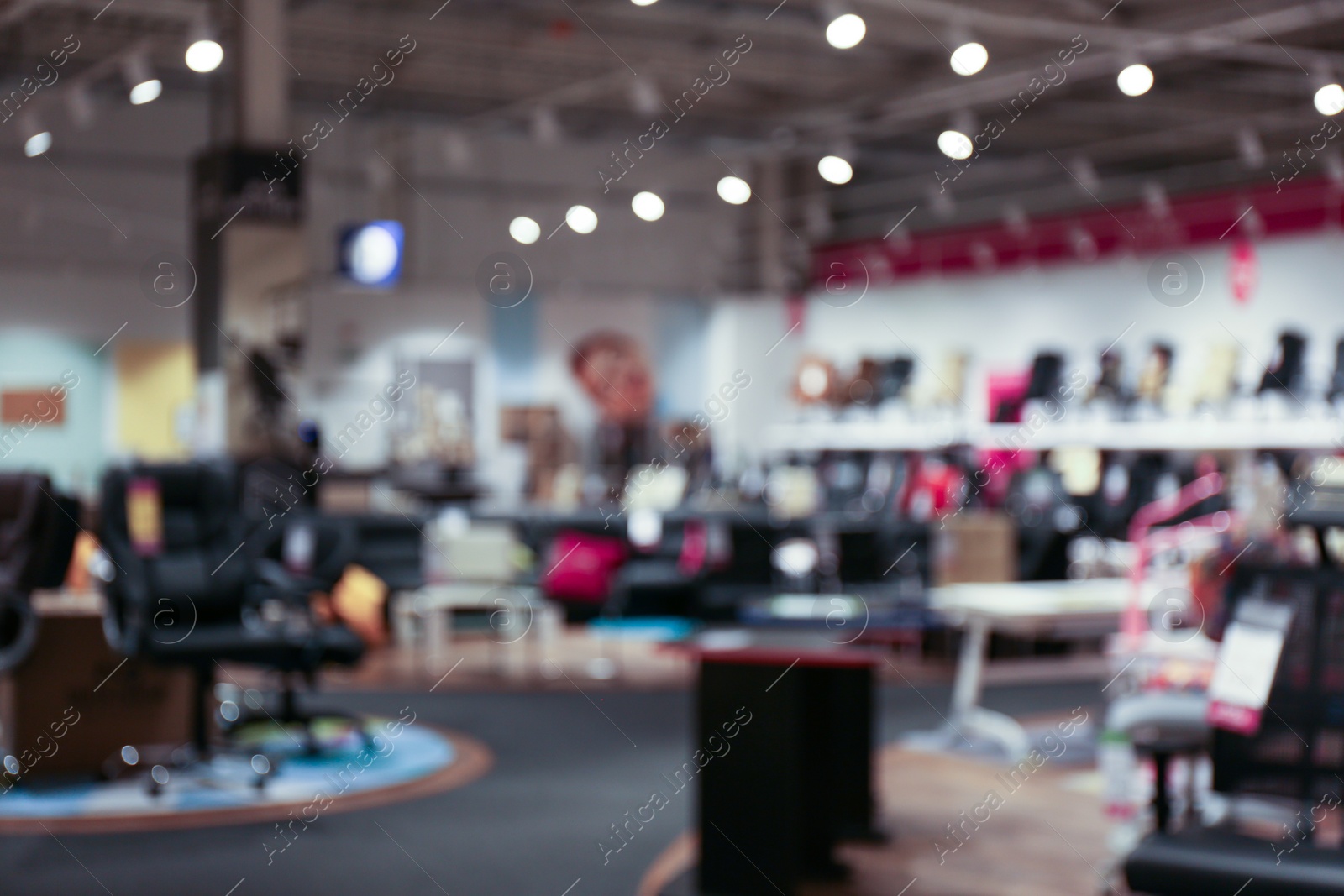 Photo of Blurred view of furniture store in mall. Bokeh effect