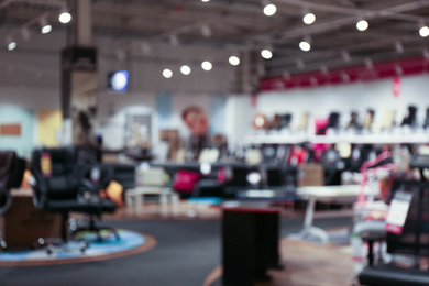 Blurred view of furniture store in mall. Bokeh effect