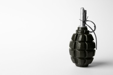 Hand grenade on white background. Space for text