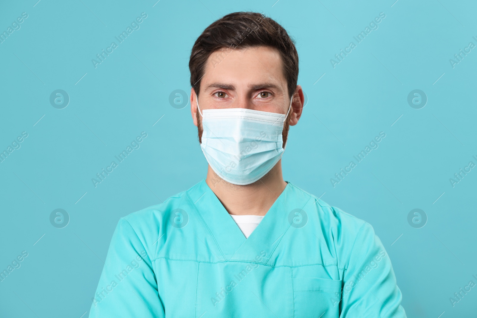 Photo of Nurse with medical mask on light blue background