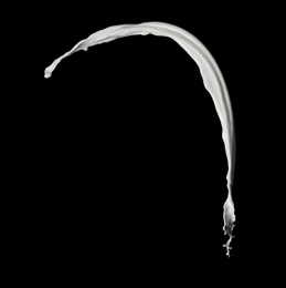 Photo of Splash of fresh milk on black background