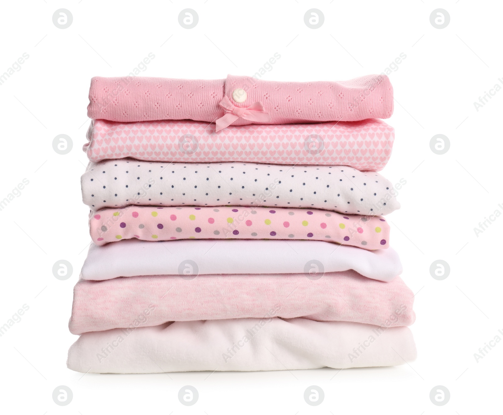 Photo of Stack of baby girl's clothes on white background