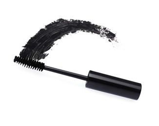 Photo of Applicator and black mascara smear on white background, top view