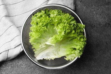 Photo of Fresh lettuce on stone table, top view