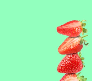 Image of Stack of fresh strawberries on aquamarine background, space for text