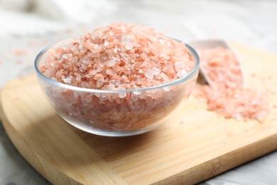 Photo of Pink himalayan salt in glass bowl on table
