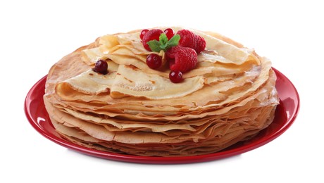 Photo of Delicious crepes with berries and mint on white background