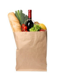 Photo of Paper bag with groceries on white background