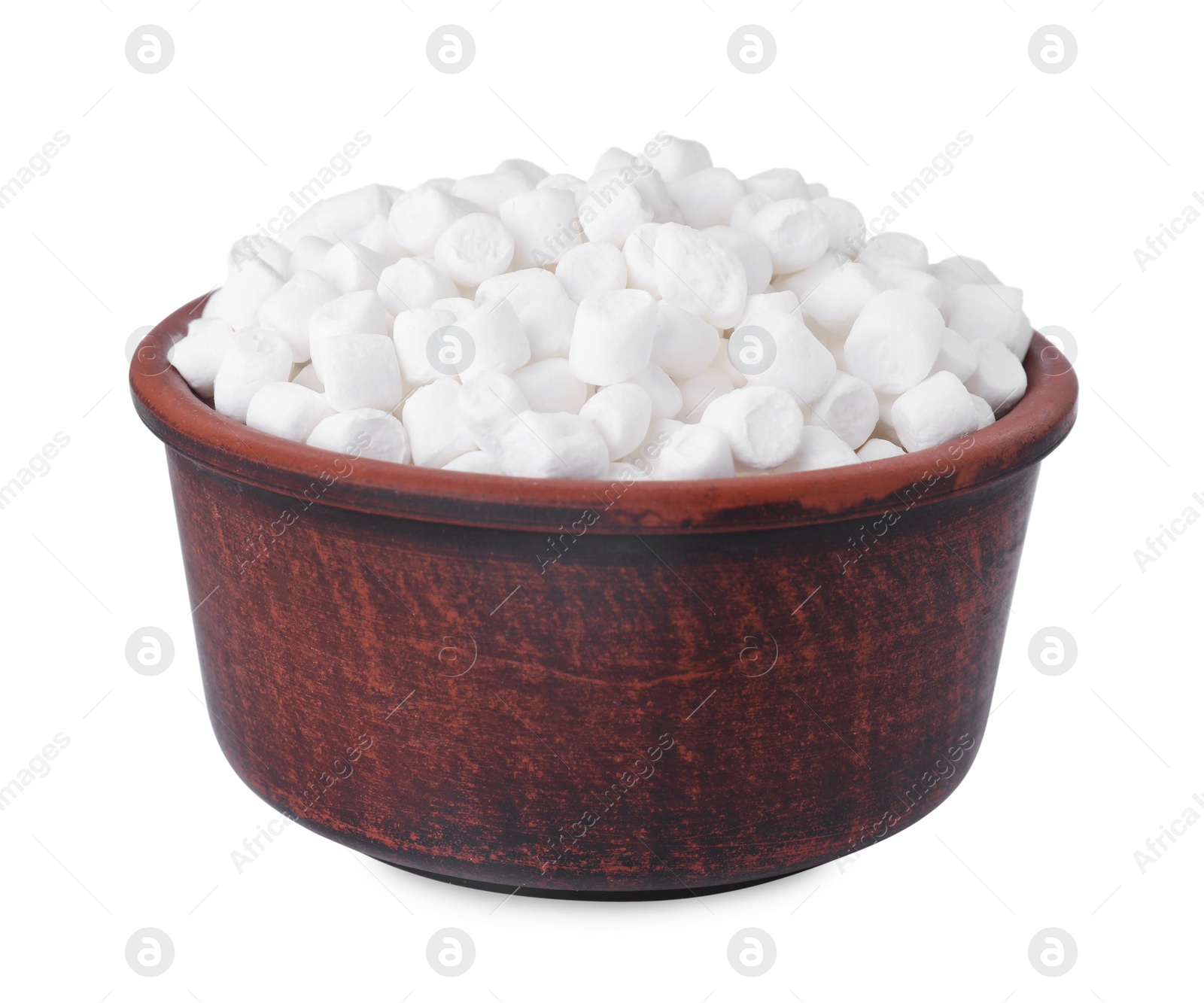 Photo of Bowl of delicious puffy marshmallows isolated on white