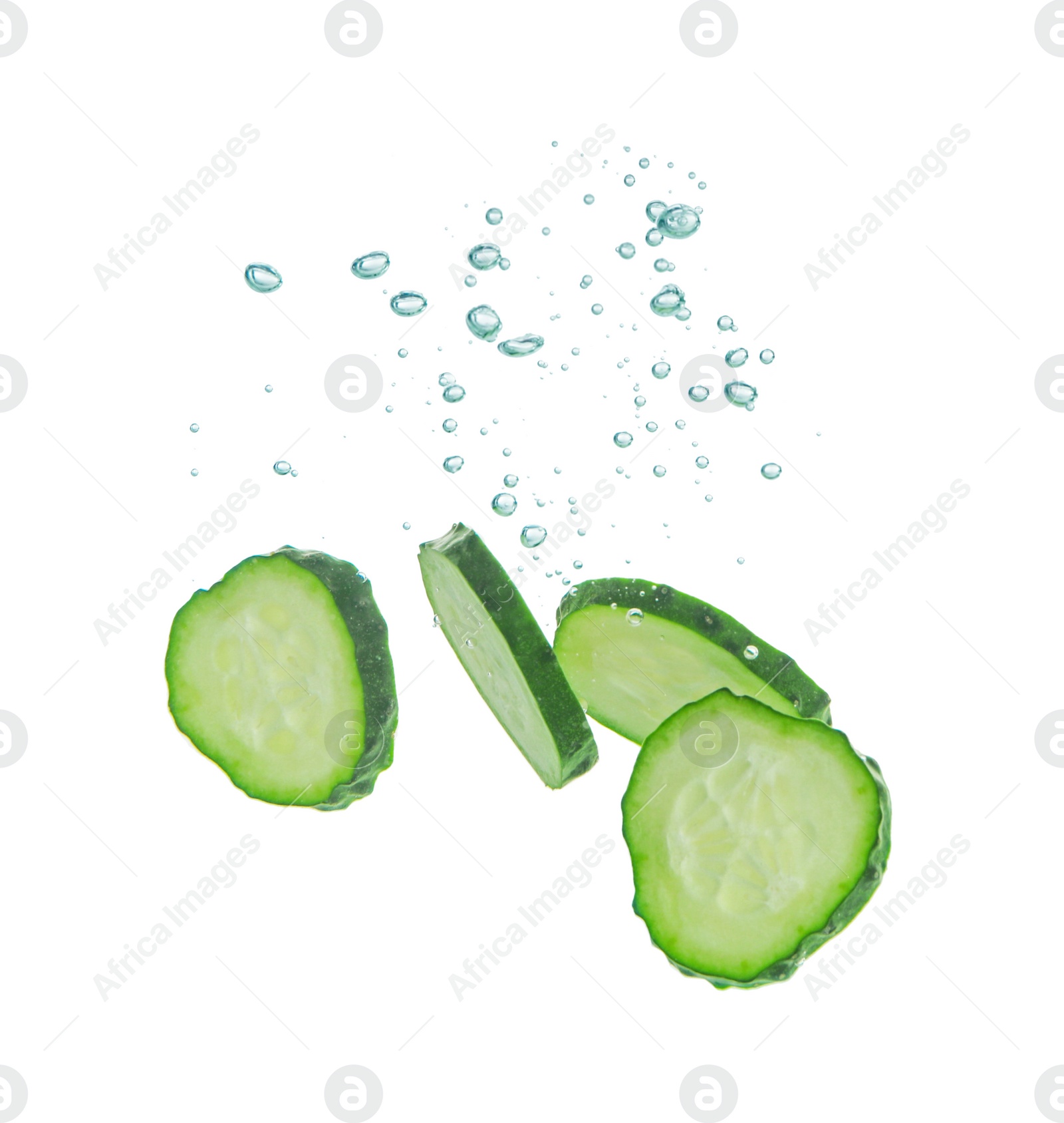 Photo of Fresh cucumber slices in water on white background