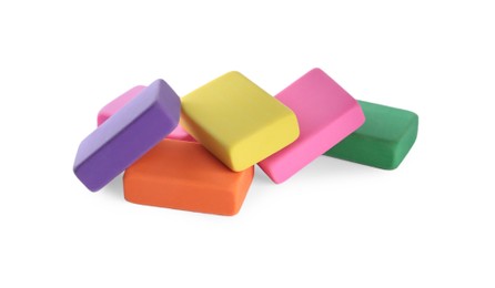 Photo of Pile of bright erasers on white background