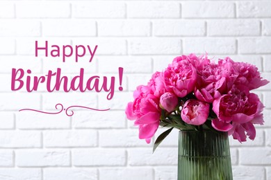 Image of Happy Birthday! Bouquet of beautiful peonies in vase near white brick wall
