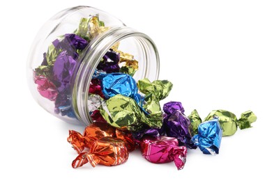 Photo of Glass jar with candies in colorful wrappers isolated on white