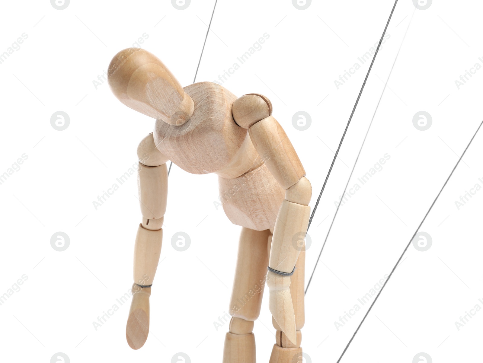 Photo of One wooden puppet with strings on white background