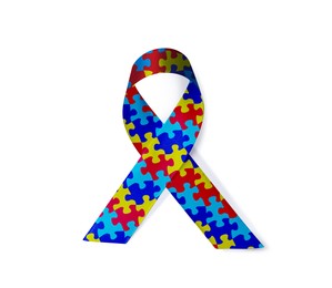 Image of World Autism Awareness Day. Colorful puzzle ribbon on white background, top view