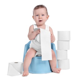 Photo of Little child sitting on baby potty and stack of toilet paper rolls against white background