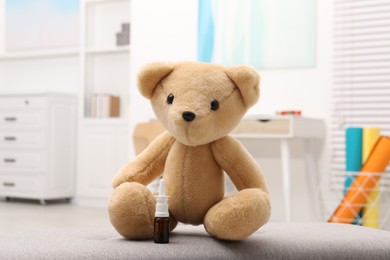 Photo of Toy cute bear with nasal spray indoors