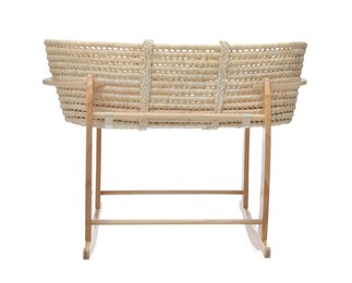 Photo of Wicker crib on white background. Interior element