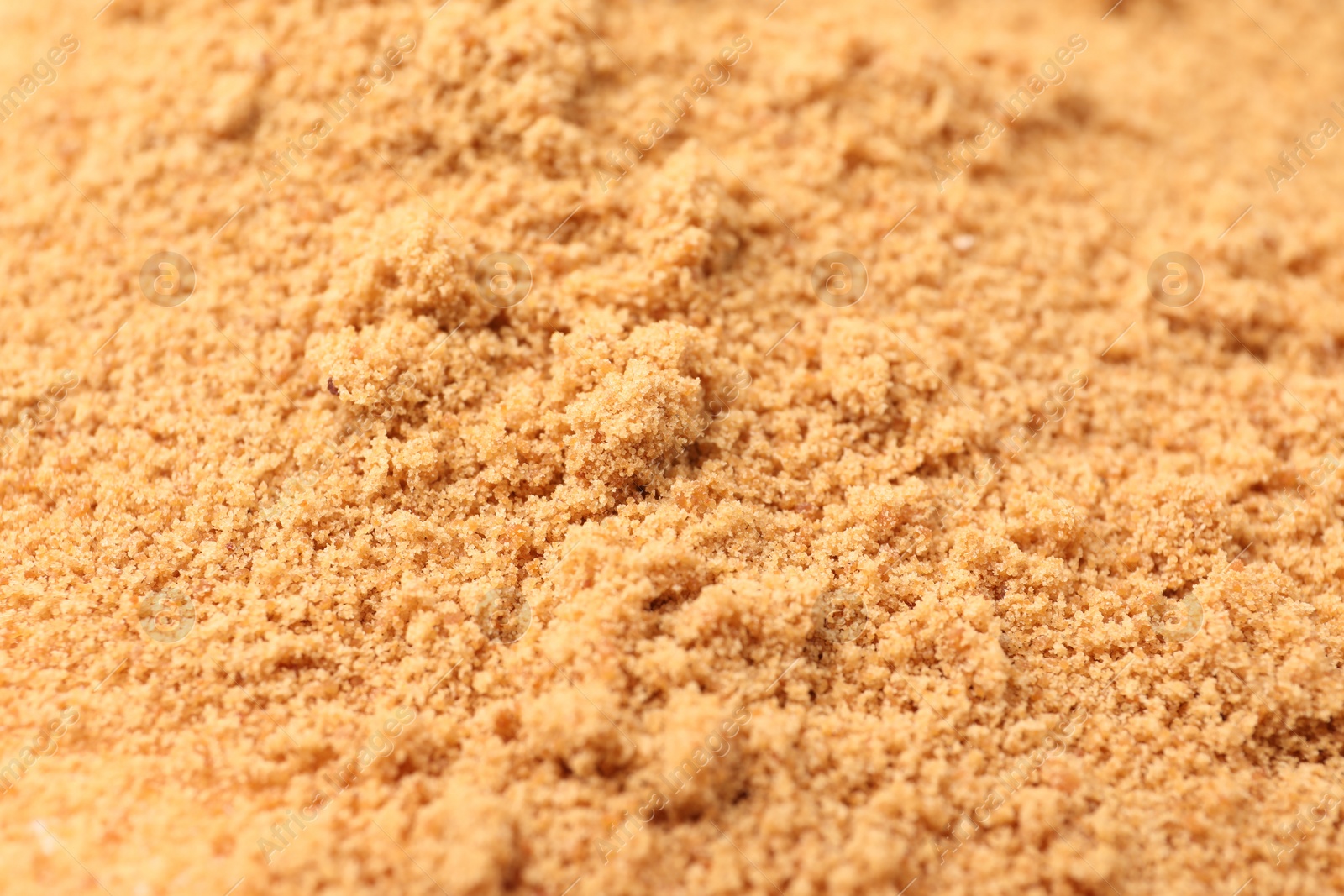 Photo of Brown coconut sugar as background, closeup view