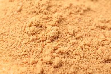 Photo of Brown coconut sugar as background, closeup view