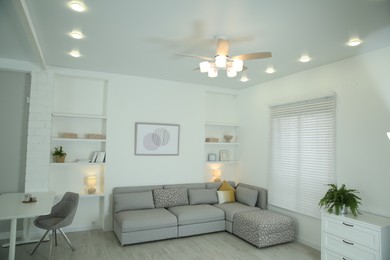 Ceiling fan, furniture and accessories in stylish living room