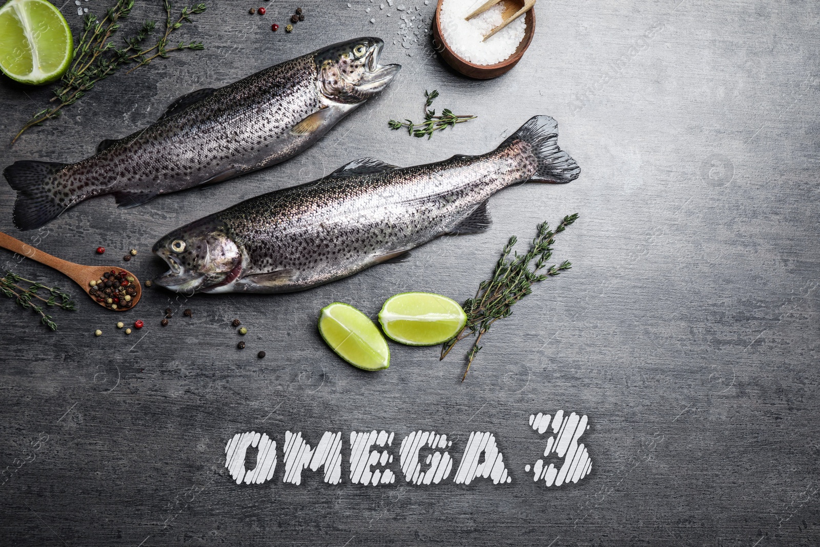 Image of Omega 3. Fresh fish, lime and spices on grey table, flat lay