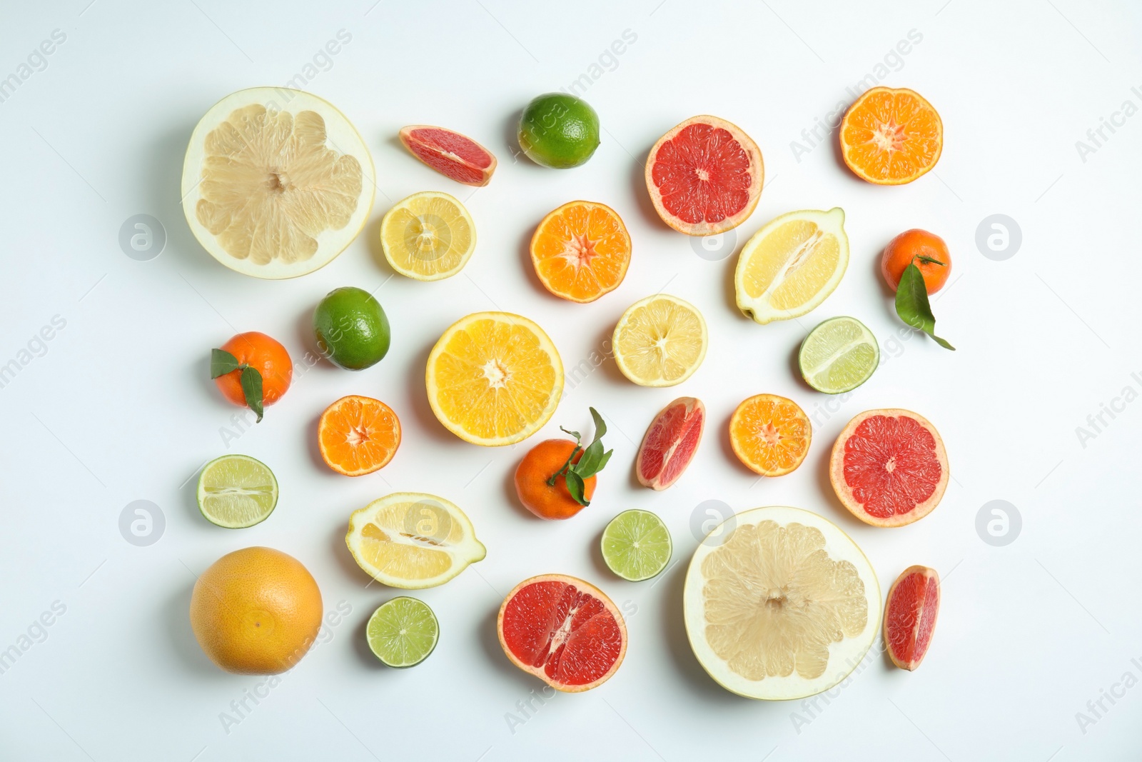 Photo of Different citrus fruits on white background, flat lay