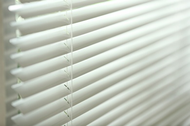 Closeup view of window with horizontal blinds