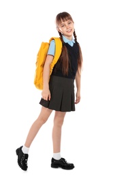 Photo of Full length portrait of cute girl in school uniform with backpack on white background