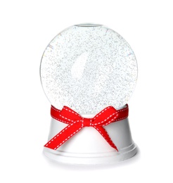 Magical empty snow globe with red bow isolated on white