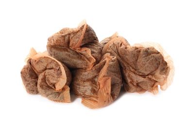 Photo of Many used tea bags on white background