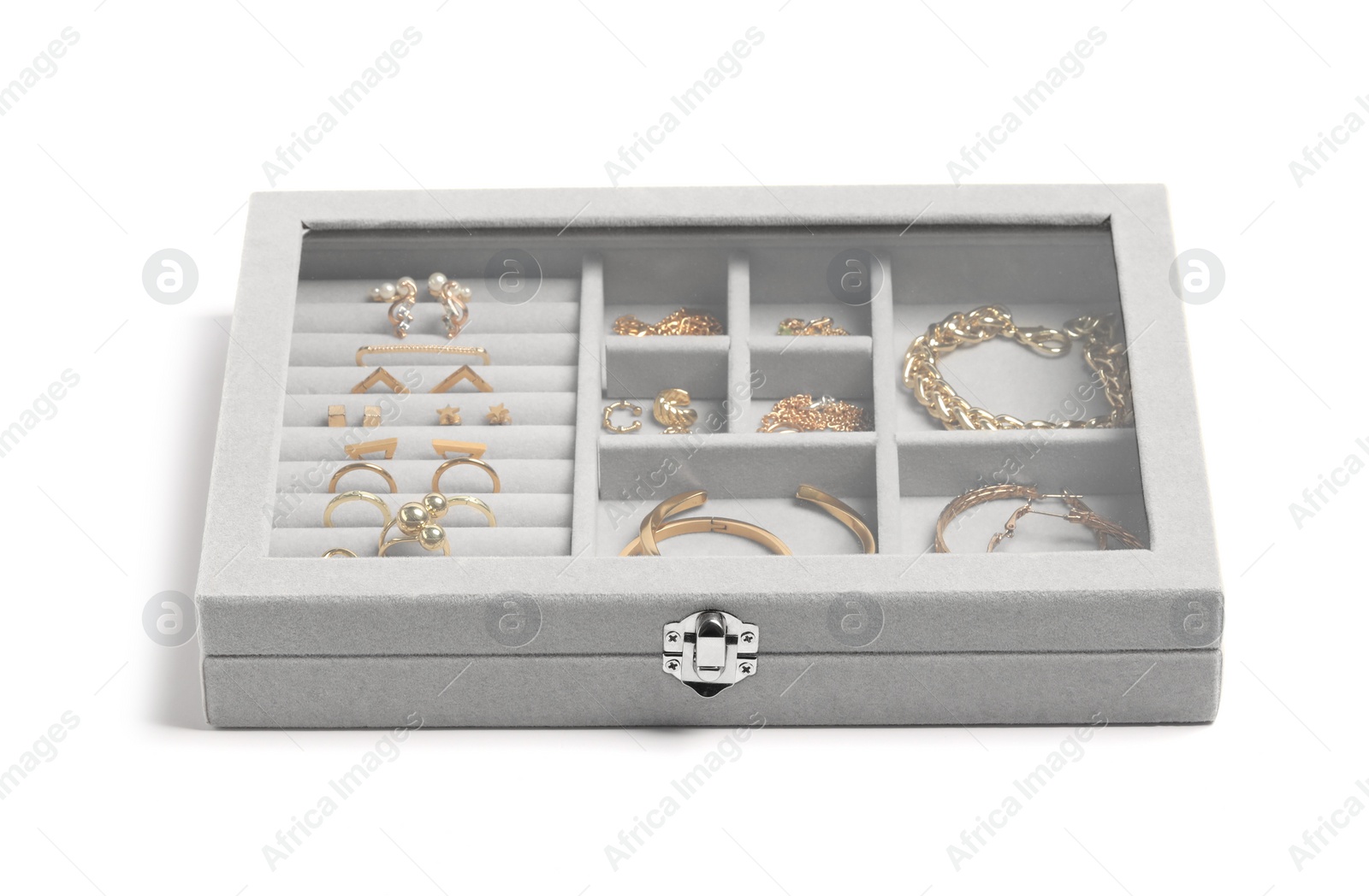 Photo of Jewelry box with many different golden accessories isolated on white