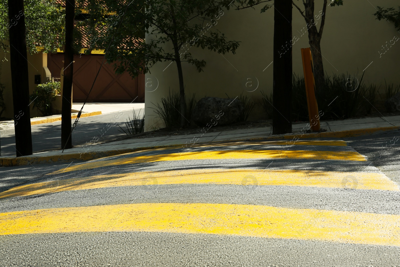 Photo of Speed bump on empty street. Road rules