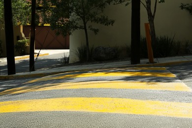 Speed bump on empty street. Road rules