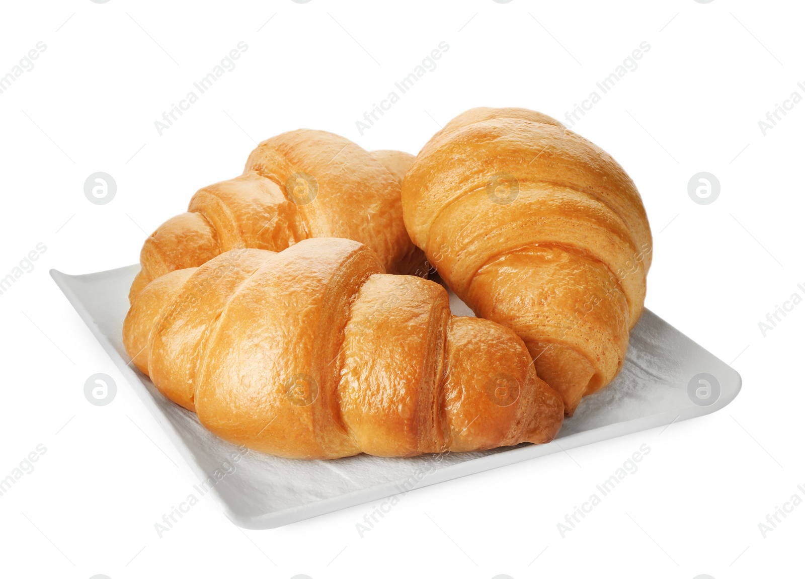 Photo of Plate with delicious fresh croissants isolated on white