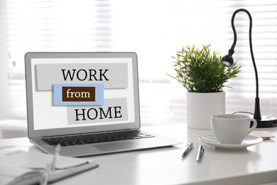 Modern laptop on table in room. Work from home