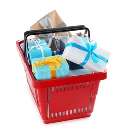 Red shopping basket with different gifts on white background