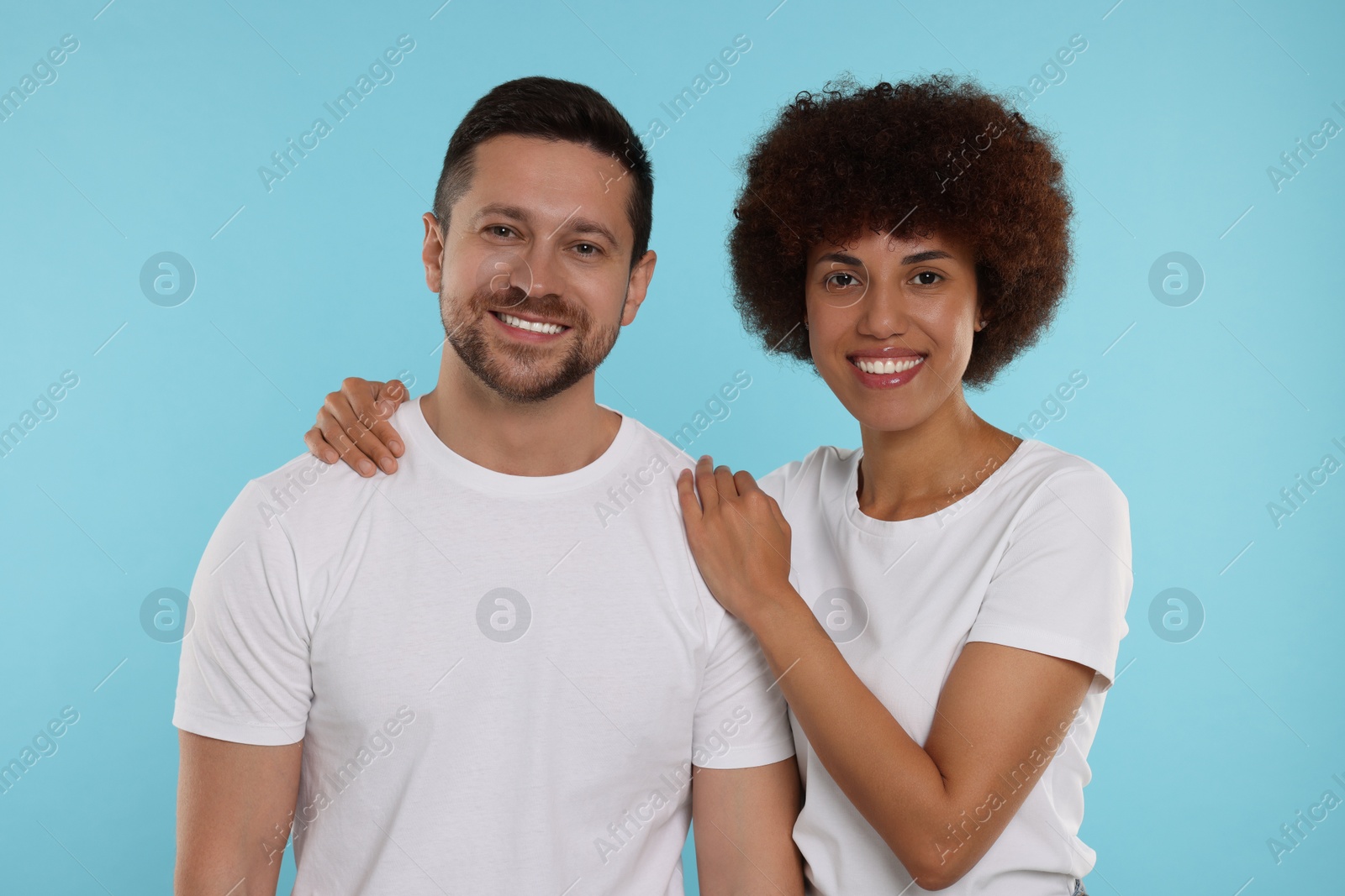 Photo of International dating. Portrait of happy couple on light blue background