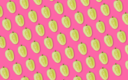 Image of Pattern of grape halves on bright pink background
